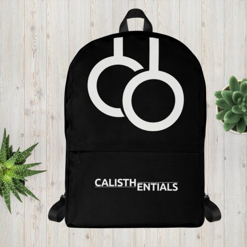 Black Calisthentials Backpack with white rings logo on a wooden background