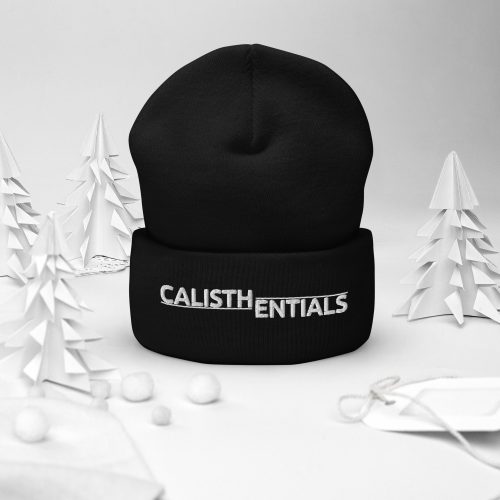 Black Calisthentials Flat Top Beanie with white logo, styled with paper trees