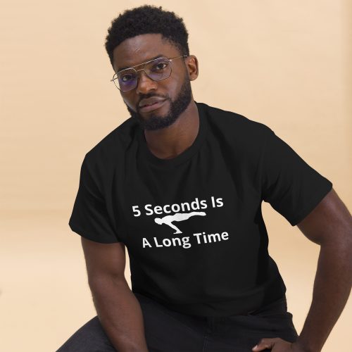Man wearing the black 5 Seconds Is A Long Time T-shirt