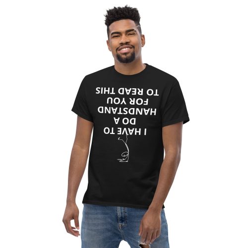 Man wearing the black Handstand Text T-shirt with upside-down message